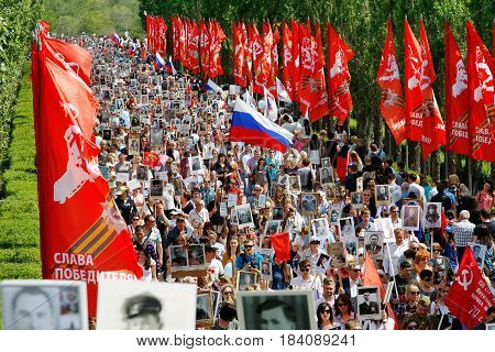 Volgograd Russia - May 9 2016: Procession of local people with photos of their relatives in Immortal Regiment on annual Victory Day on Mamaev Hill in Volgograd