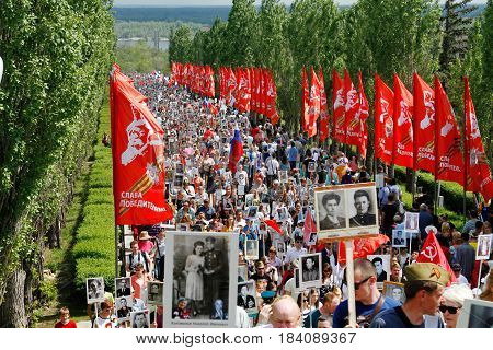 Volgograd Russia - May 9 2016: Procession of local people with photos of their relatives in Immortal Regiment on annual Victory Day on Mamaev Hill in Volgograd
