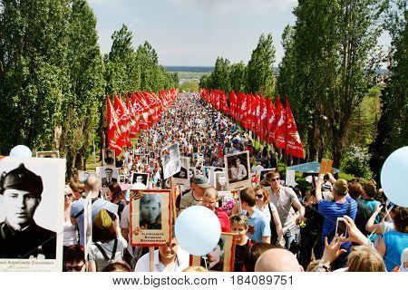 Volgograd Russia - May 9 2016: Procession of local people with photos of their relatives in Immortal Regiment on annual Victory Day on Mamaev Hill in Volgograd