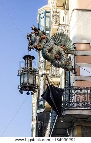 Barcelona. Chinese dragon on House of Umbrellas (Casa Bruno Cuadros) building on La Rambla. Catalonia, Spain.