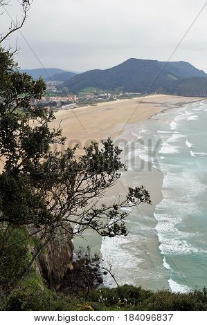 Beach and village of Berria from Mount Buciero, Santoña, Cantabria, Spain