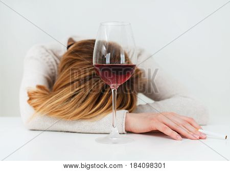 Drunk Woman Sleeping On The Table. Female Alcoholism.