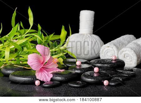 Beautiful Spa Concept Of Pink Hibiscus Flower, Bamboo, Thai Herbal Compress Ball, Candles And Stones