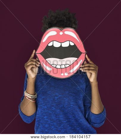 African Woman holding Paper Mouth Over her Face