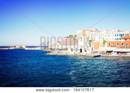 embankment and venetian bay with Turkish Mosque Yiali Tzami of Chania, Crete, Greecer, retro toned