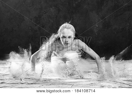 Black and white portrait of young dancer with white flour