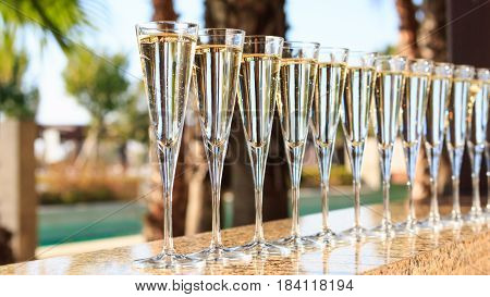 Many Glasses Of Champagne Or Prosecco Near Resort Pool In A Luxury Hotel. Pool Party.