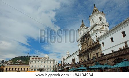 Quito, Pichincha / Ecuador - April 30 2016: Church and Monastery of St. Francis with the El Panecillo Hill in the background. This is the largest colonial architectural complex in Latin America