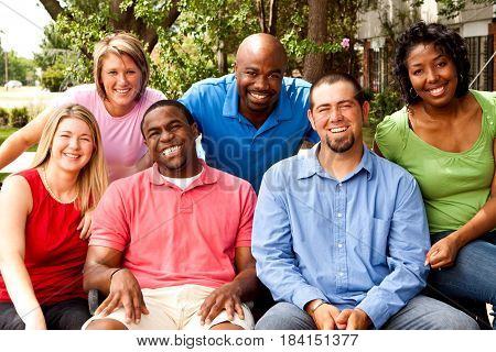 Happy commuinity group of people talking and laughing.