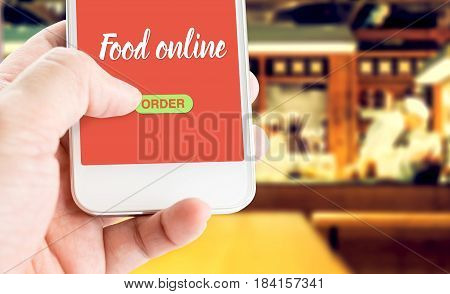 Hand Holding Mobile With Order Food Online With Blur Restaurant Background, Food Online Business Con