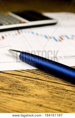 calculatorpencil and money on graffica the Dow Jones on forex market