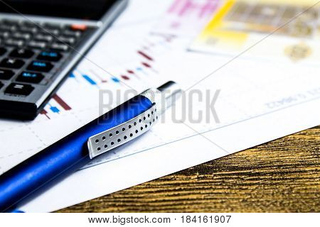 calculatorpencil and money on graffica the Dow Jones on forex market
