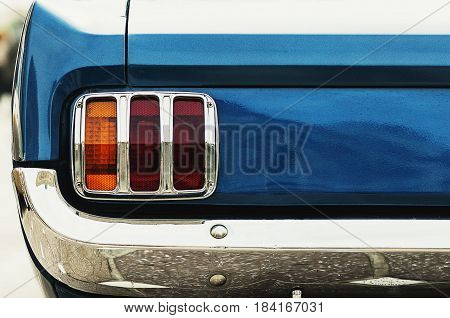 Closeup on the taillight of an old retro car. Back light and bumber.