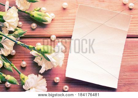 Flowers And Piece Of Paper