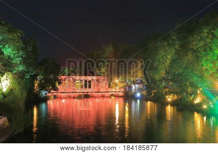 Rough lake night light up cityscape in Guilin China