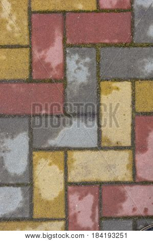 Texture of road surface made of multicolor pave stones