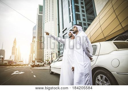 Arabic businessmen in Dubai with limousine car