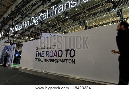 Hannover Germany - March 22 2017: White wall with a slogan about the digital transformation at CeBIT 2017. CeBIT is the world's largest trade fair for information technology.