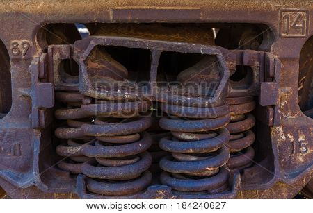 Close-up of rusted springs on freight train boxcar Sterling Colorado