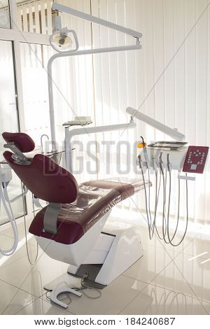 Concept of dental. stomatology concept - interior of new modern dental clinic office with chair.. Dental equipment