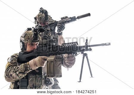 Two Army Rangers in field Uniforms with weapon. Studio shot