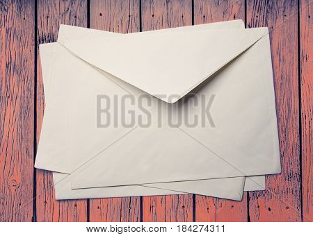 Evenlopes On Coloured Wooden Background