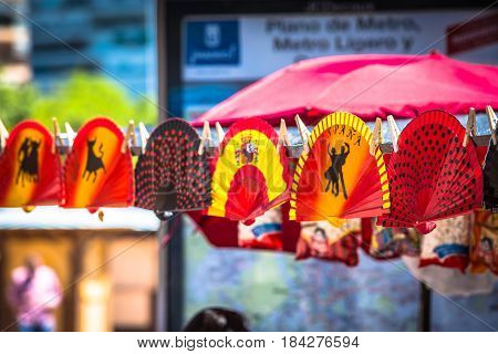Colorful Spanish Fans arranged for sale in a store