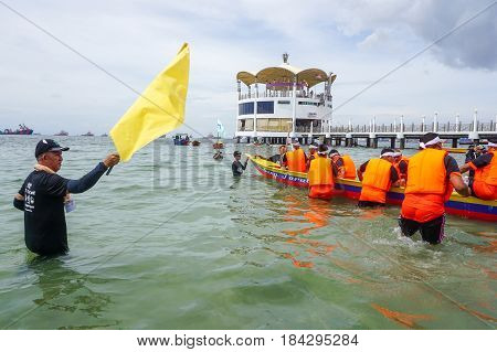 Labuan,Malaysia-April 29,2017:Group of boatman with life jacket participate in a boat tug of war games in Labuan International Sea Sports Complex at Labuan,Malaysia on 29th April 2017.