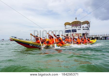 Labuan,Malaysia-April 29,2017:Group of boatman with life jacket participate in a boat tug of war games in Labuan International Sea Sports Complex at Labuan,Malaysia on 29th April 2017.