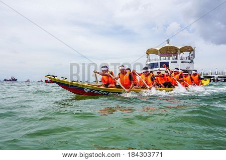 Labuan,Malaysia-April 29,2017:Group of boatman with life jacket participate in a boat tug of war games in Labuan International Sea Sports Complex at Labuan,Malaysia on 29th April 2017.