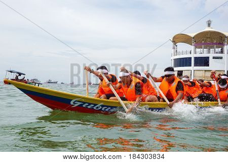 Labuan,Malaysia-April 29,2017:Group of boatman with life jacket participate in a boat tug of war games in Labuan International Sea Sports Complex at Labuan,Malaysia on 29th April 2017.