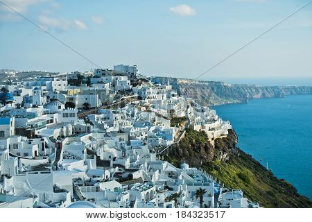 View of Caldera volcanic cliff at sunset, Imerovigli village, Santorini island, Greece