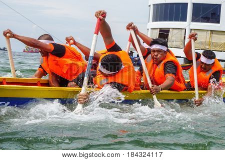 Labuan,Malaysia-April 29,2017:Group of boatman with life jacket participate in a boat tug of war games in Labuan International Sea Sports Complex at Labuan,Malaysia on 29th April 2017.