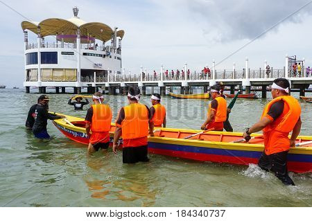 Labuan,Malaysia-April 29,2017:Group of boatman with life jacket participate in a boat tug of war games in Labuan International Sea Sports Complex at Labuan,Malaysia on 29th April 2017.
