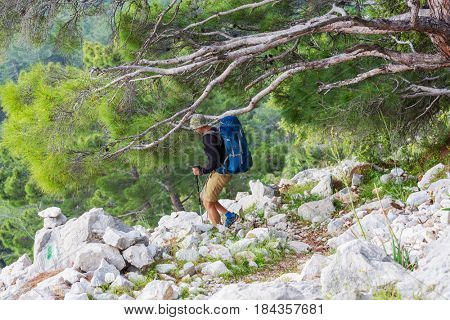 Hiking in famous Lycian Way in the Turkey. Backpacker in the trail.