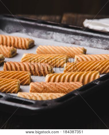 Homemade sweet cookies on a baking sheet. Baking in oven.