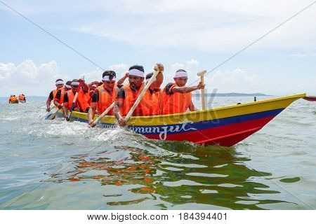 Labuan,Malaysia-April 29,2017:Group of boatman with life jacket participate in a boat tug of war games in Labuan International Sea Sports Complex at Labuan,Malaysia on 29th April 2017.