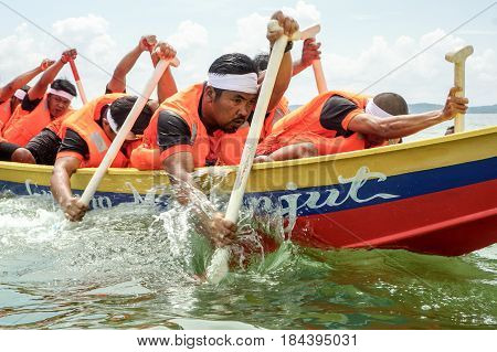Labuan,Malaysia-April 29,2017:Group of boatman with life jacket participate in a boat tug of war games in Labuan International Sea Sports Complex at Labuan,Malaysia on 29th April 2017.
