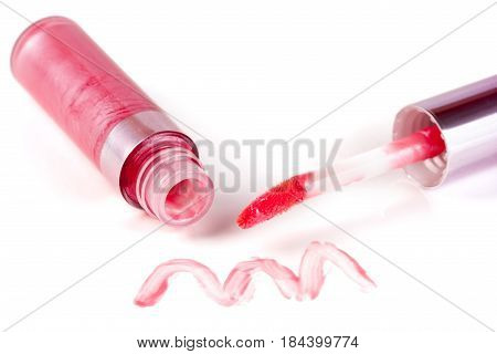 pink lip gloss isolated on white background.