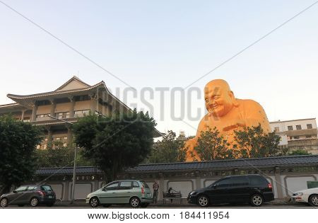 TAICHUNG TAIWAN - DECEMBER 9, 2016: Unidentified people visit Bao Jue temple. Bao Jue temple is most famous for the presence of a giant smiling Buddha.