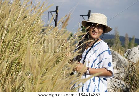 Thai Women People Travel And Posing With Stone And Poaceae Or Gramineae At Suan Hin Pha Ngam Or Thai