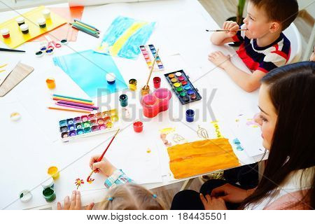 Kids painting on an art class at school