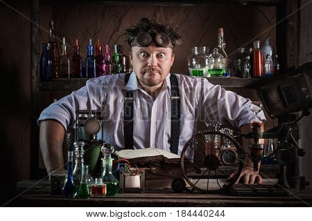 crazy medieval scientist working in his laboratory