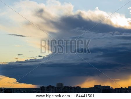 Stormy Supercell Weather Over The City At Sunset.
