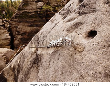 Iron Twisted Rope Stretched Between Rocks In Climbers Patch Via Ferrata.  Rope Fixed In Rock