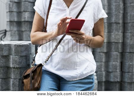 Woman holiday lifestyle casual outfit using smart phone