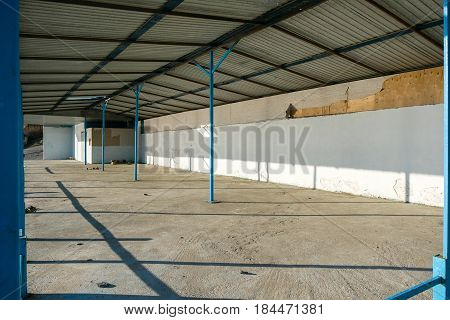 Abandoned old building with no walls on the street.