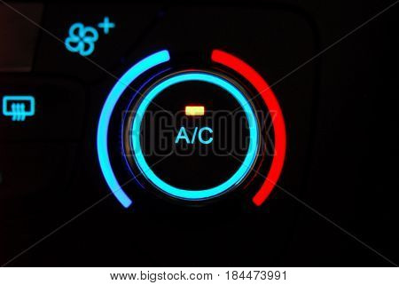 manual switches the air conditioning on the dashboard of the car