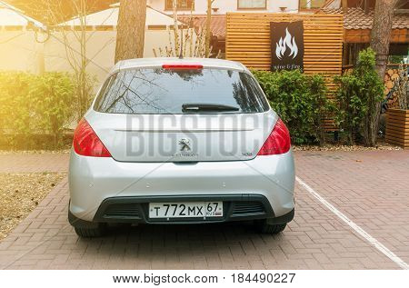 Smolensk, Russia - April 25, 2017: New Peugeot 308 parked near hotel in sunlight.