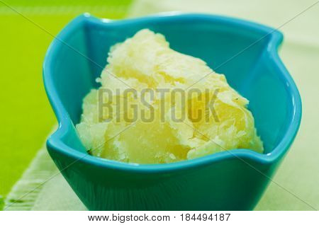 Delicious smashed yuka inside of a magenta bowl.